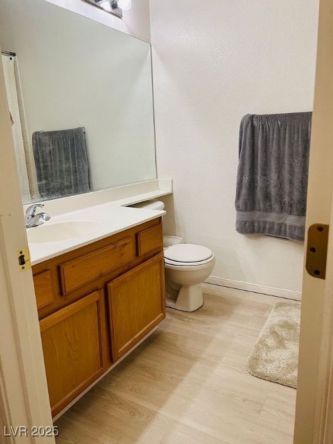 Bathroom with vanity and wood finished floors | Image 18