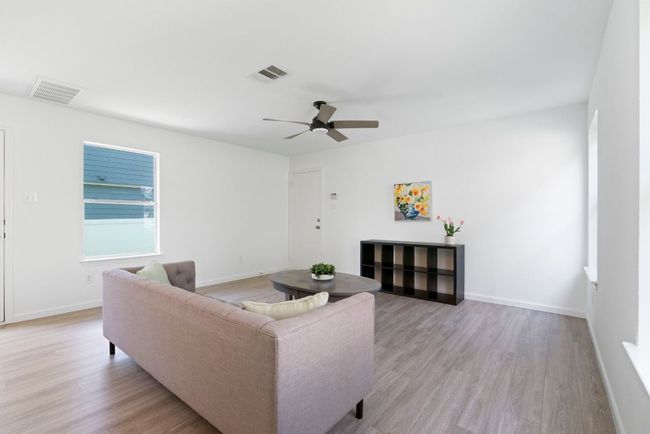 With ample room and a perfect wall for an entertainment center, it’s an ideal setting for family time. | Image 16