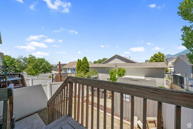 Wooden deck featuring a residential view and a fenced backyard | Image 21