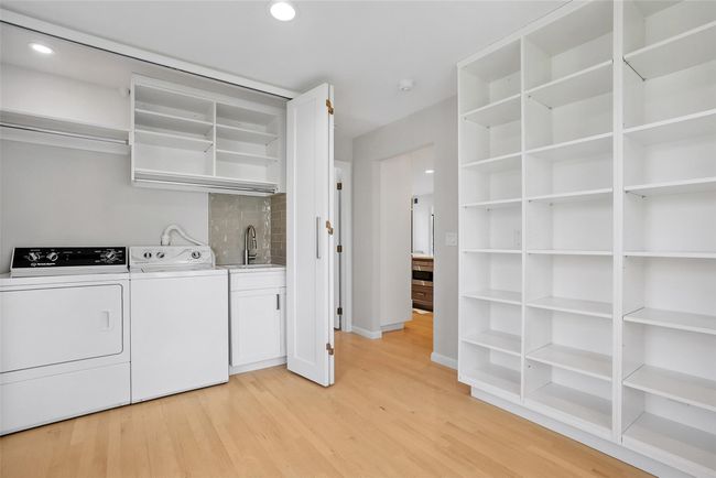 The washer/dryer and new sink are discretely concealed behind the doors! | Image 15