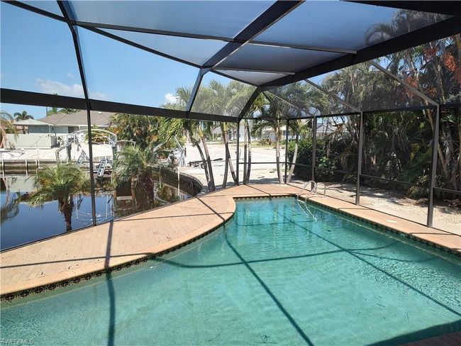 12321 Moon Shell Dr, House other with 3 bedrooms, 3 bathrooms and 2 parking in MATLACHA ISLES FL | Image 13