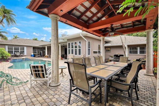 View of swimming pool featuring grilling area, a patio, ceiling fan, and a gazebo | Image 32