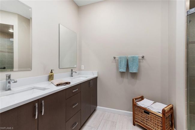 Bathroom featuring vanity and walk in shower | Image 12