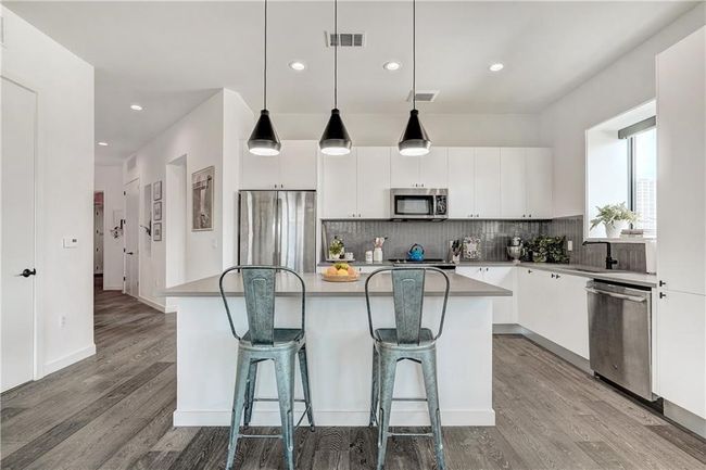 The bright, fresh and open kitchen is perfect for hosting! | Image 8