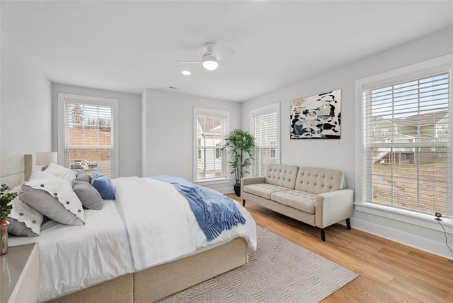 Bedroom 3 with LVP flooring, recessed lighting, ceiling fan and walk-in closet. Abundance of natural light, windows with custom blinds | Image 27