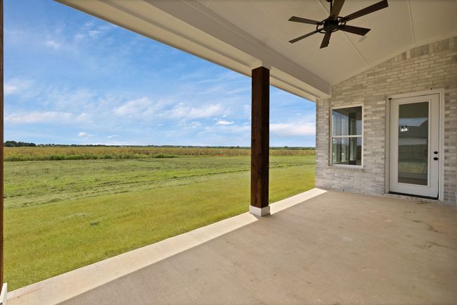 View of patio / terrace featuring a rural view and a ceiling fan | Image 37