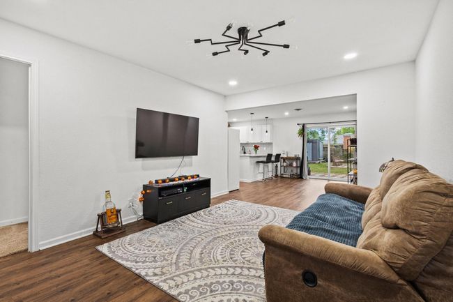 Living room featuring dark wood-type flooring, recessed lighting, and baseboards | Image 14