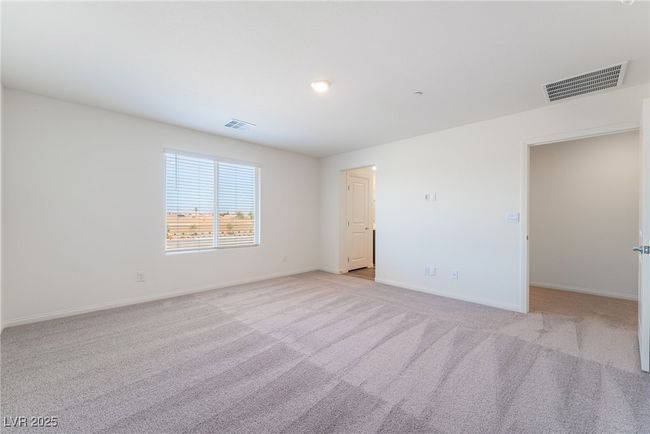 Unfurnished bedroom featuring light carpet and baseboards | Image 18
