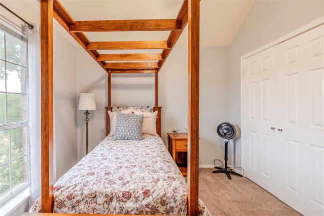 Carpeted bedroom featuring multiple windows and a closet | Image 32