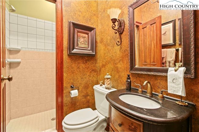 Full bath on main level, adjacent to Primary Suite | Image 26