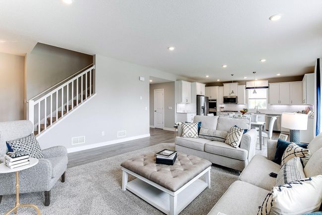 Cozy family room just off of the dinette making the main level open and spacious. | Image 16