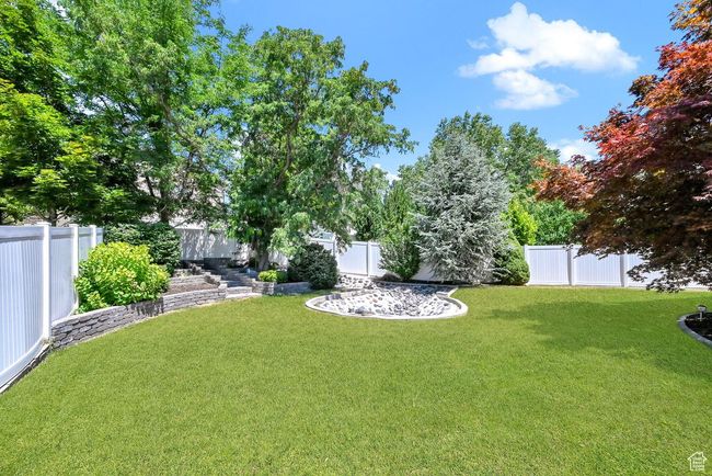 View of yard with a fenced backyard | Image 43