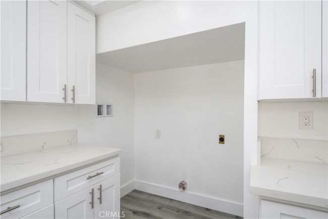 Laundry in kitchen. | Image 10