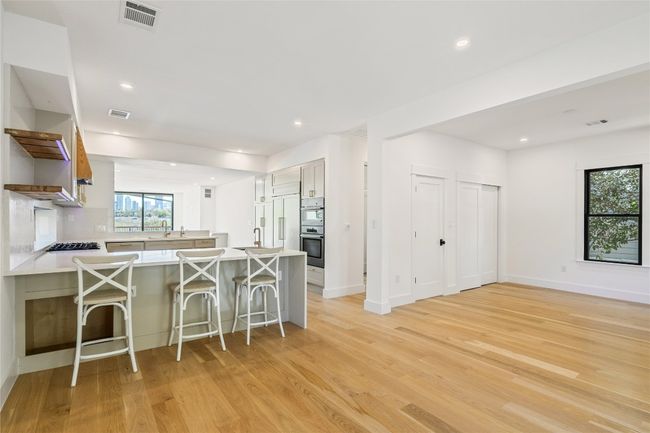 Kitchen with barstool seating | Image 23