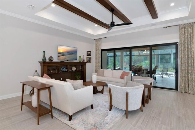 Living Room opens to Lanai and Saltwater Pool | Image 4