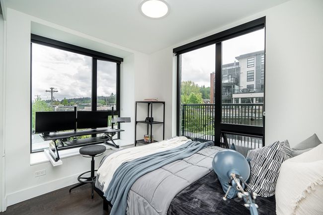 Bedroom with access to outside and wood finished floors | Image 21