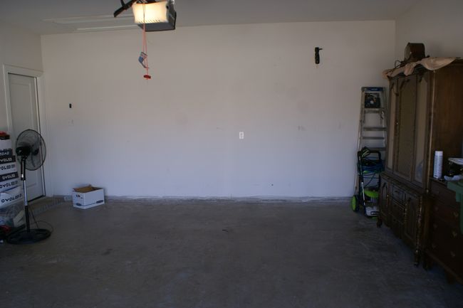 Garage with a garage door opener | Image 29