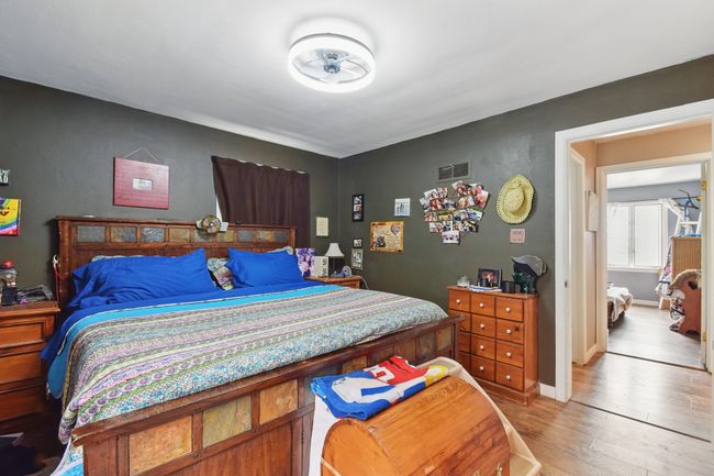Bedroom featuring light wood-style flooring | Image 12
