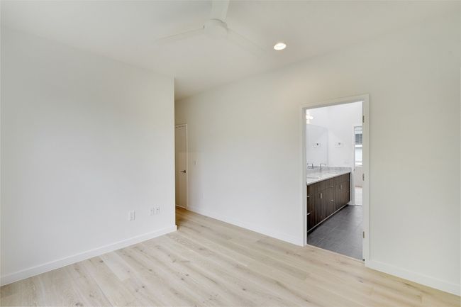 Unfurnished room with wood finished floors, ceiling fan, baseboards, and recessed lighting | Image 16