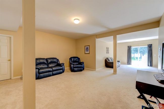 This space connects to the game room and a walk-out slider. | Image 29