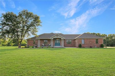 Ranch-style home featuring a front lawn | Image 1