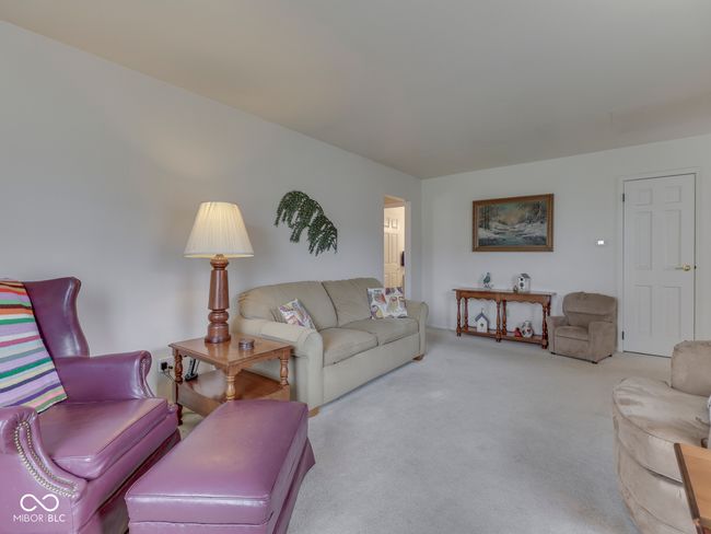 View from living room toward hallway leading to bedrooms and hall bath | Image 11