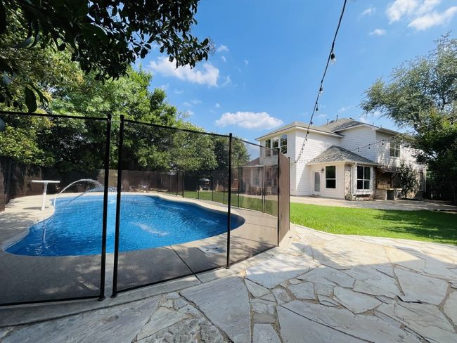 View of the pool with child safety fence in place for added protection. | Image 32
