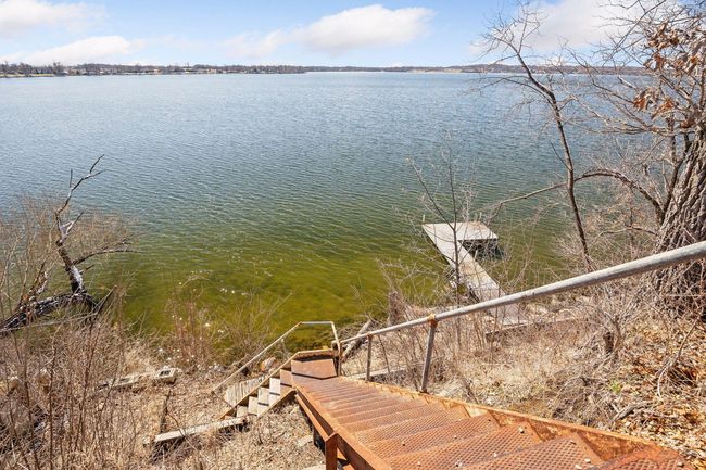 A set of well-placed stairs leads you right to the shoreline, making it easy to enjoy swimming, fishing, or simply relaxing by the water. | Image 19