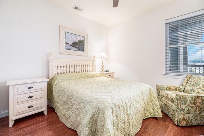 Bedroom featuring dark wood-style floors and a ceiling fan | Image 22