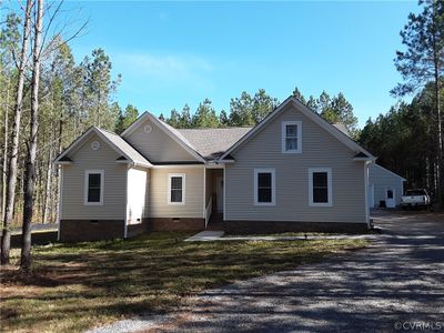 View of front facade with a front yard | Image 1