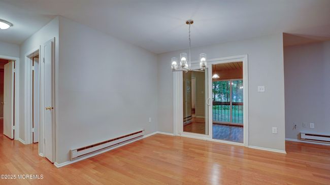 Dining area with sliders to enclosed porch | Image 7