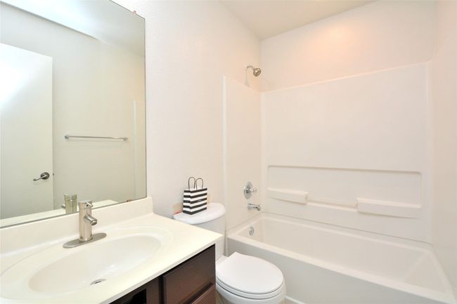 Full bath with bathtub / shower combination, vanity, and toilet | Image 18