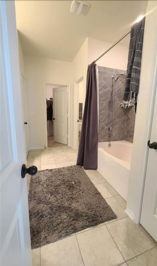 Bathroom with shower / tub combo and tile patterned floors | Image 20