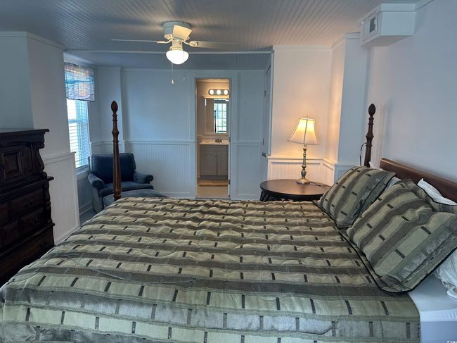 Bedroom featuring a wainscoted wall and ensuite bath | Image 17