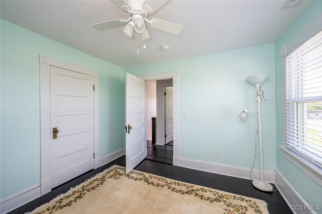 Unfurnished living room featuring baseboards, ceiling fan, and hardwood / wood-style flooring | Image 21