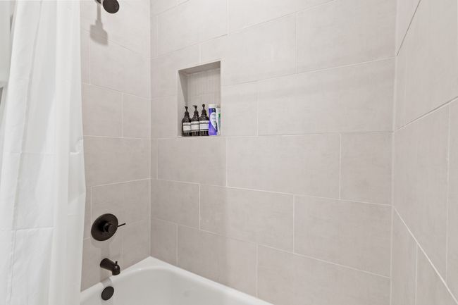 Full bath featuring shower / tub combo with curtain | Image 25