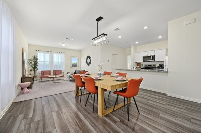 Dining area with recessed lighting, visible vents, and dark wood-style flooring | Image 6