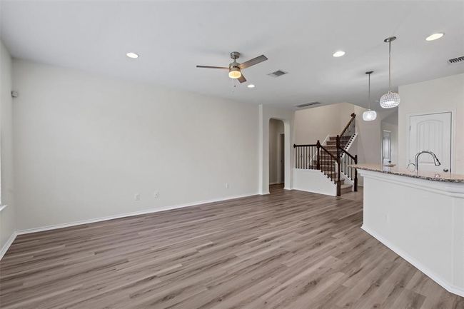 Living room open to Kitchen w/large Island Bar Granite countertops | Image 12
