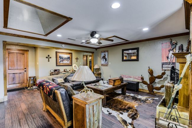 Living area featuring a ceiling fan, recessed lighting, crown molding, and dark wood-type flooring | Image 7