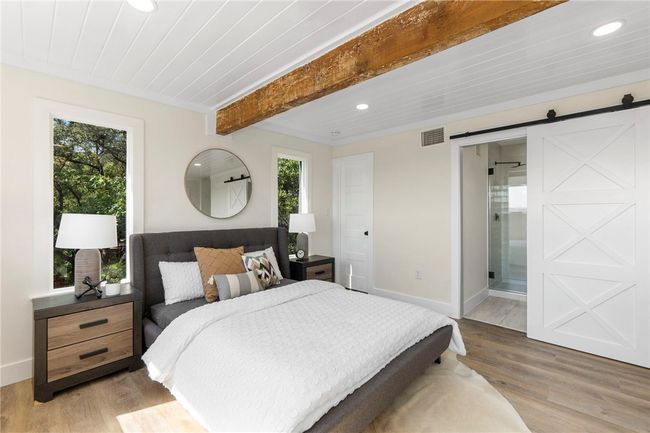 The secondary bedroom also features a walk-in closet and direct access to the guest bath. | Image 22