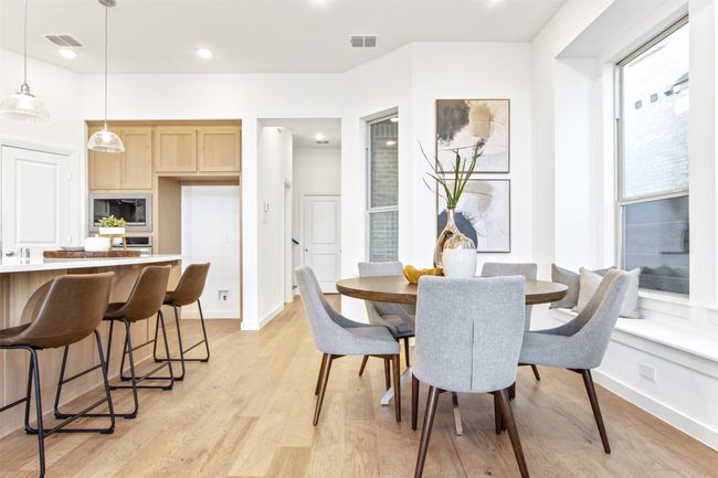 Dining area with light wood finished floors and recessed lighting | Image 19