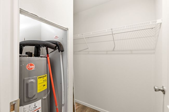primary closet w/ water heater access | Image 8