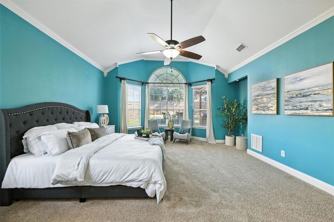 Bedroom featuring ornamental molding, carpet flooring, lofted ceiling, and ceiling fan | Image 16