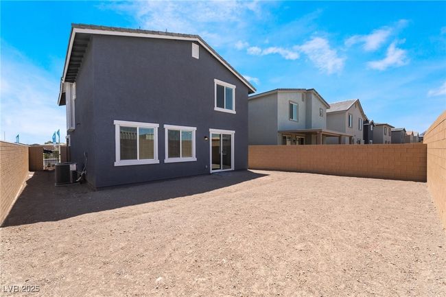 Back of property with a fenced backyard and stucco siding | Image 37
