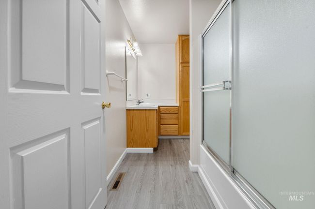 Bathroom featuring vanity and wood finished floors | Image 17