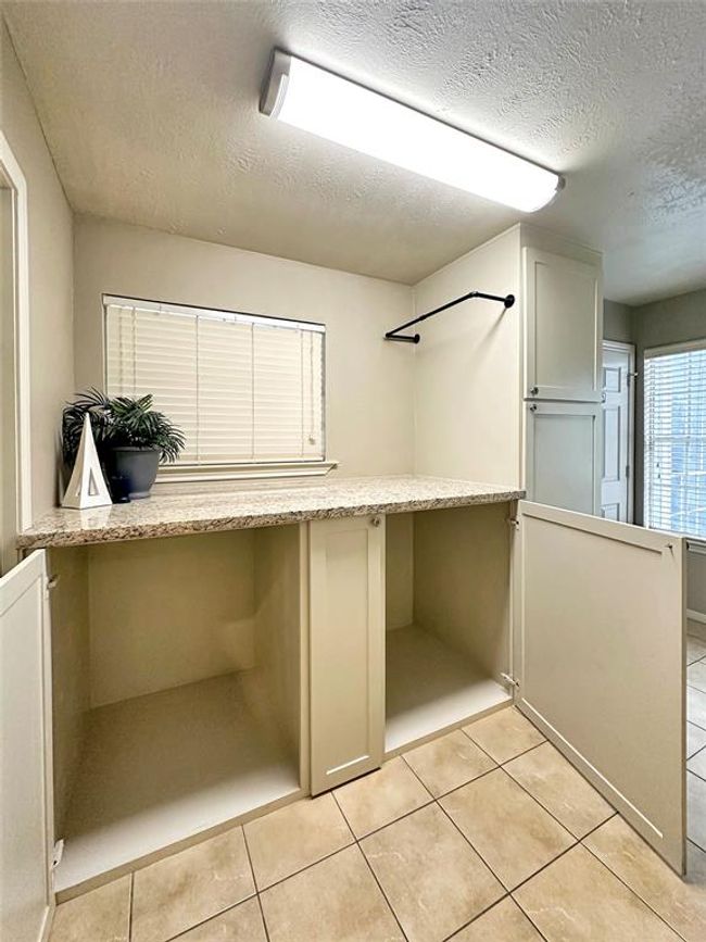 Washer & Dryer cabinets can hide the undone laundry. | Image 14