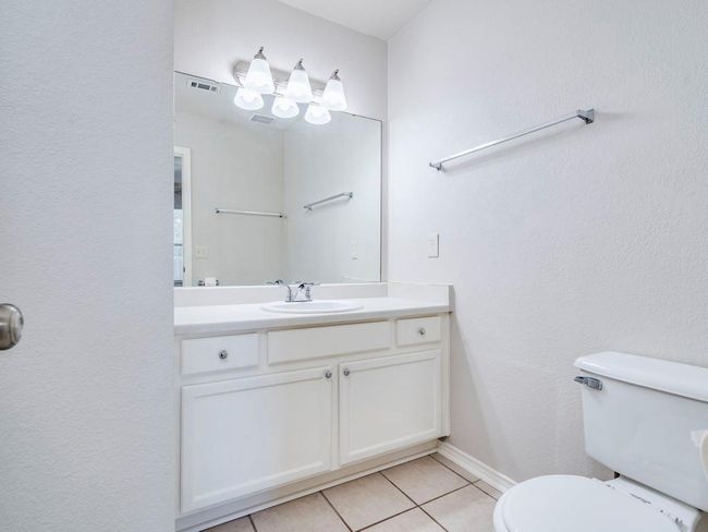 Bathroom featuring tile patterned floors and vanity | Image 19