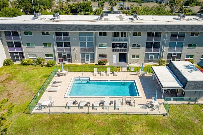 Pool featuring a patio area, fence, and a yard | Image 34