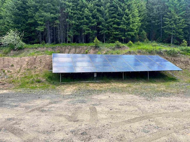 View of outbuilding with a forest view and solar panels | Image 42
