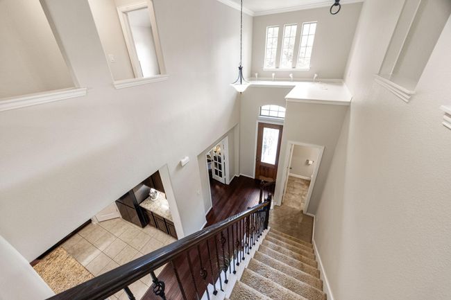 Such a grand stairway and entry. The landing above the entry is perfect for holiday decorations. The lighting system really compliments this landing and can be controlled with your phone. | Image 26